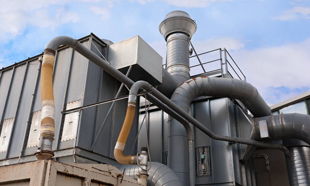 Industrial factory air filtration system. Tubes, tank and chimney.